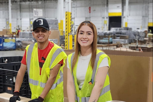 man and woman packaging boxes photo