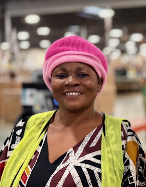 woman smiling in warehouse photow
