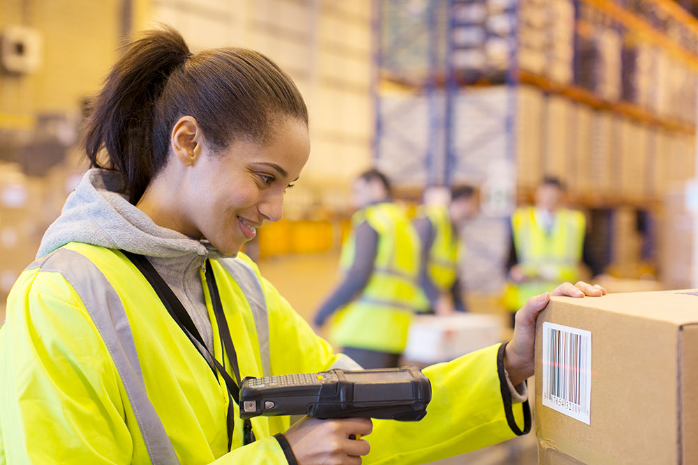 worker scanning boxes photo