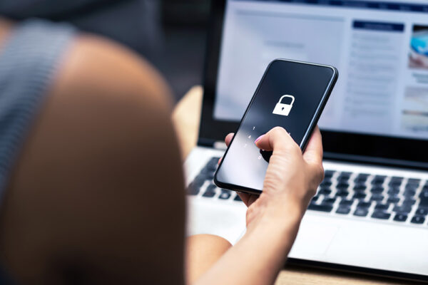 woman entering password on phone photo